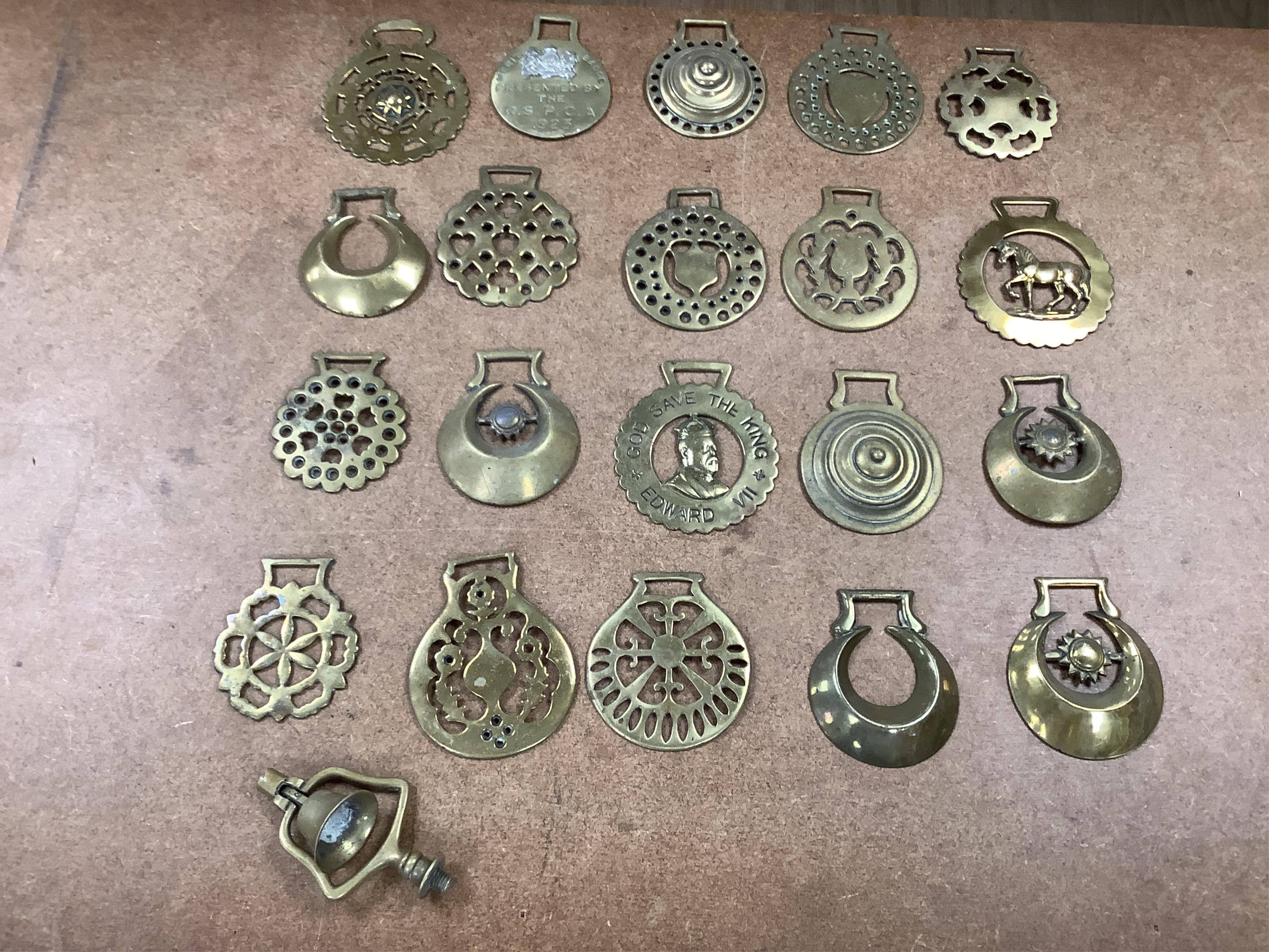 A collection of various horse brasses